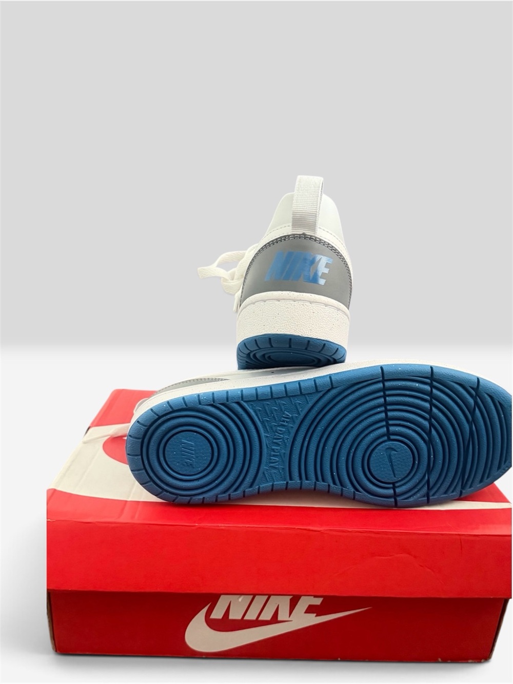 Nike Kids White Sneakers with Blue Soles